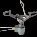 One-piece pocket stove shown next to a coin for scale.