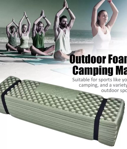 Blue ultralight inflatable camping mattress laid out on a forest floor during a hike.