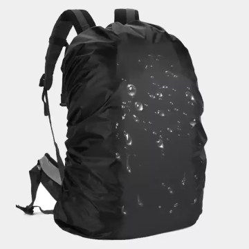 Black waterproof backpack rain cover shown fitted on a large 100L hiking rucksack in the rain.