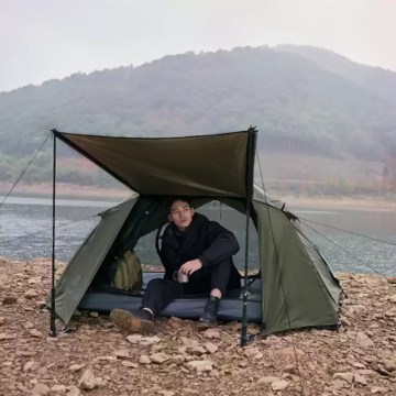 camping tent with front awning by lakeside