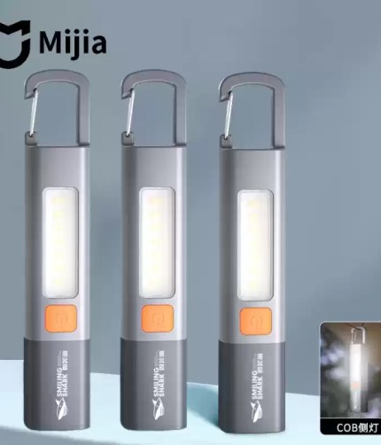 LED Flashlight with zoomable lens and USB charging port.