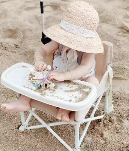 Compact travel baby booster seat folded for storage.