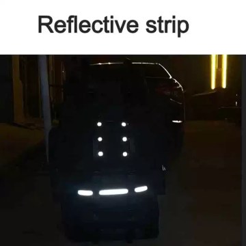 The large camping bag being loaded with professional climbing and hiking gear.