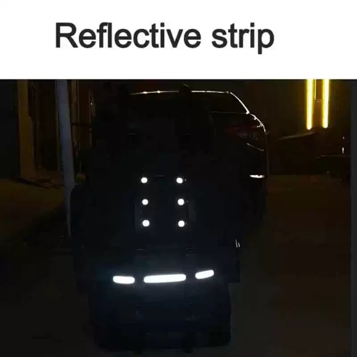 The large camping bag being loaded with professional climbing and hiking gear.