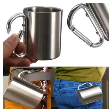 Portable outdoor cup clipped to a hiking backpack.