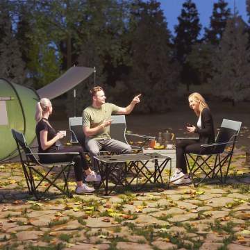 portable camping table and chairs used outdoors for family dining UK