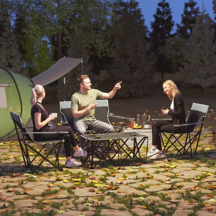 Foldable grey table and chairs for outdoor sports and picnics.