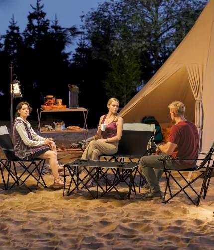 Outsunny 4 piece foldable camping table and chairs set in grey.