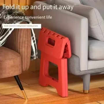 Compact foldable step stool stored neatly beside sofa, space-saving design for home use