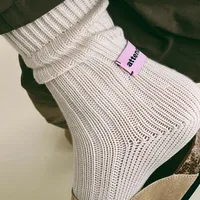 Cream Knitted Crew Socks Cream knitted crew socks with ribbed texture and soft cuff