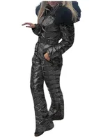Black Quilted Ski Jumpsuit Women’s black quilted one-piece ski jumpsuit with hood