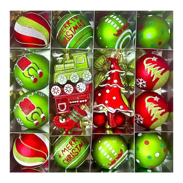 Compartment box filled with red and green Christmas tree ornaments.