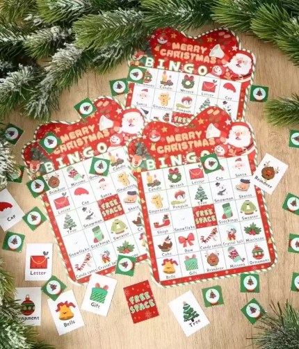 Christmas bingo game set with red cards, calling chips, and player markers.
