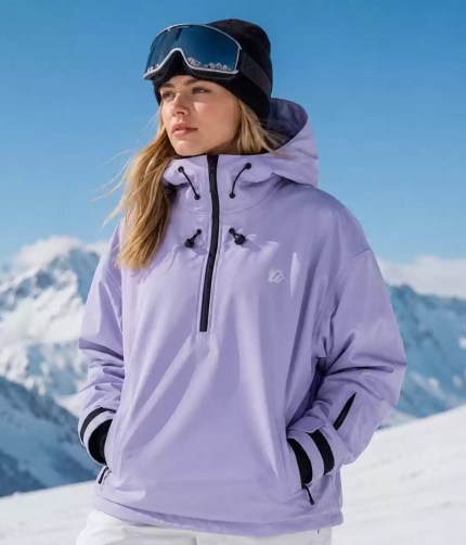 Man wearing a white hooded ski jacket and black beanie in snowy mountains