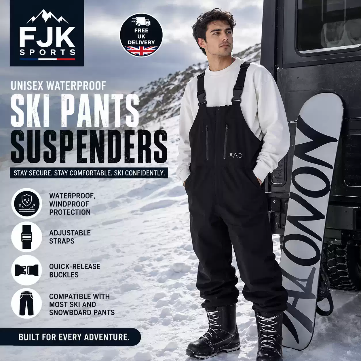 Man wearing black waterproof ski bib trousers with adjustable suspenders beside a snowboard on a snowy mountain slope