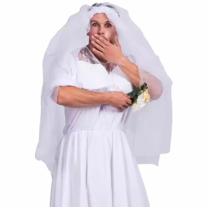 Funny man in bride dress covering mouth holding flower bouquet.