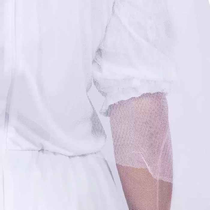 Detail close-up of white mesh lace sleeve on bride costume dress.