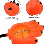 Detail view showing opening size and claw design of orange monster hand candy bag.