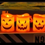 Orange jack-o’-lantern LED candles for Halloween décor