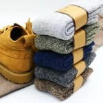 : Men’s thick wool winter socks displayed with winter footwear