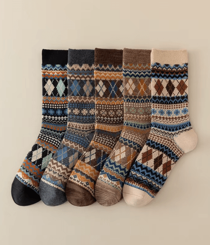 Five pairs of patterned knitted winter crew socks in black, grey, brown, taupe and cream colours