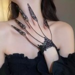 Black lace finger chain bracelet with claw rings.