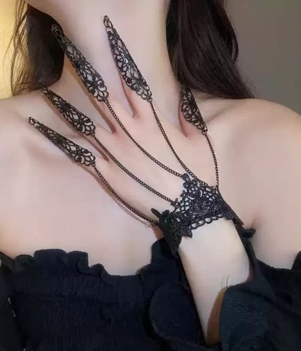 Black lace finger chain bracelet with claw rings.