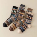 Five pairs of patterned knitted winter crew socks in assorted colours