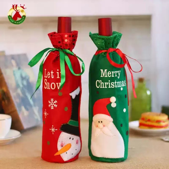 Festive Santa and snowman Christmas bottle covers displayed on wine bottles for seasonal decoration.