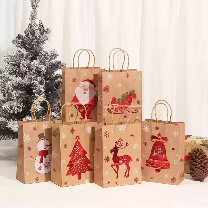 christmas-gift-bags-assorted-festive-designs Assorted Christmas gift bags with Santa, sleigh, snowman, tree, reindeer and bell designs
