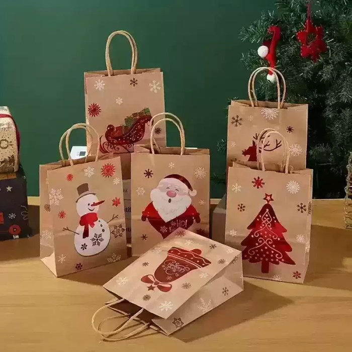 christmas-paper-gift-bags-mixed-designs Collection of handled Christmas gift bags with Santa, snowman, Christmas tree, sleigh and festive prints.