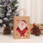 Brown Christmas gift bag with handles featuring a smiling Santa Claus and snowflake print.