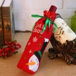 Red snowman Christmas wine bottle bag with green ribbon and festive Let It Snow design.