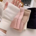 Fluffy knit fingerless gloves featuring a soft faux fur texture, rib-knit cuffs, and a thumb hole design for cozy winter wear.