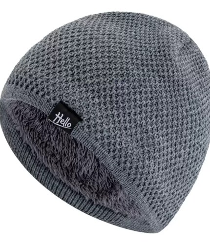 Close-up view of a grey thermal knit beanie featuring a "Hello" brand label on the fabric.