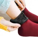 Beige and black fleece-lined thermal socks for cold-weather warmth