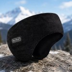 Black thermal ear warmer headband displayed on a snowy rock against a backdrop of mountains.