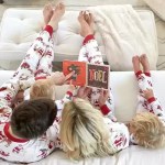 Family relaxing together in matching Christmas pyjamas during the festive season