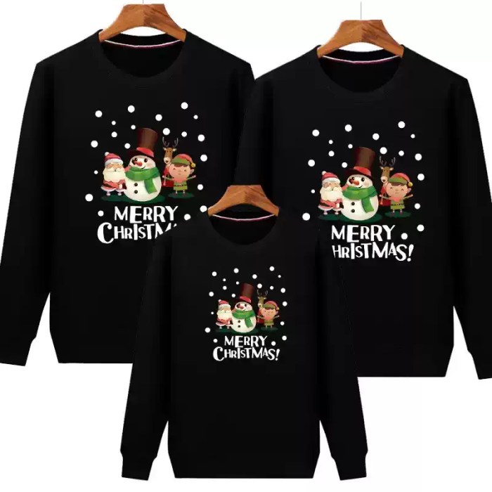 black-family-christmas-sweatshirts.webp Yellow matching family Christmas sweatshirts with festive cartoon print.