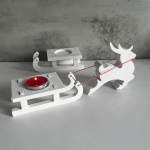 White reindeer and sleigh Christmas candle holder with red tealight.