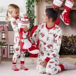 Mother and daughter in matching Santa pajamas.