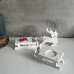 White Christmas reindeer and sleigh candle holder set for festive decoration.