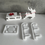 Silicone mold set for making a Christmas reindeer and sleigh candle holder.
