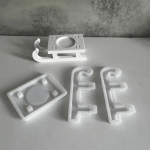 Silicone mold parts for a DIY Christmas sleigh candle holder.