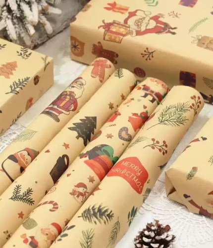 Kraft paper Christmas gift wrapping rolls with Santa and gingerbread man designs.