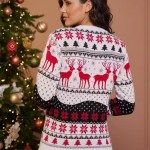 Back view of a woman in blue jeans wearing a white, red, and black fair isle reindeer Christmas sweater.