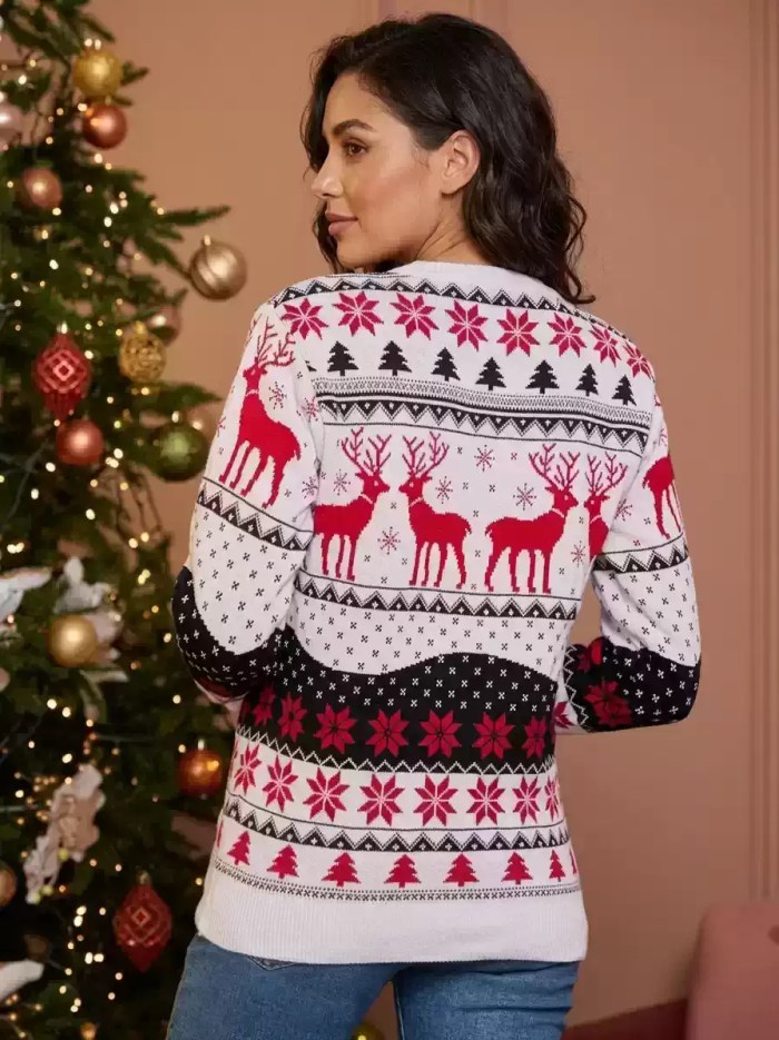 Back view of a woman in blue jeans wearing a white, red, and black fair isle reindeer Christmas sweater.