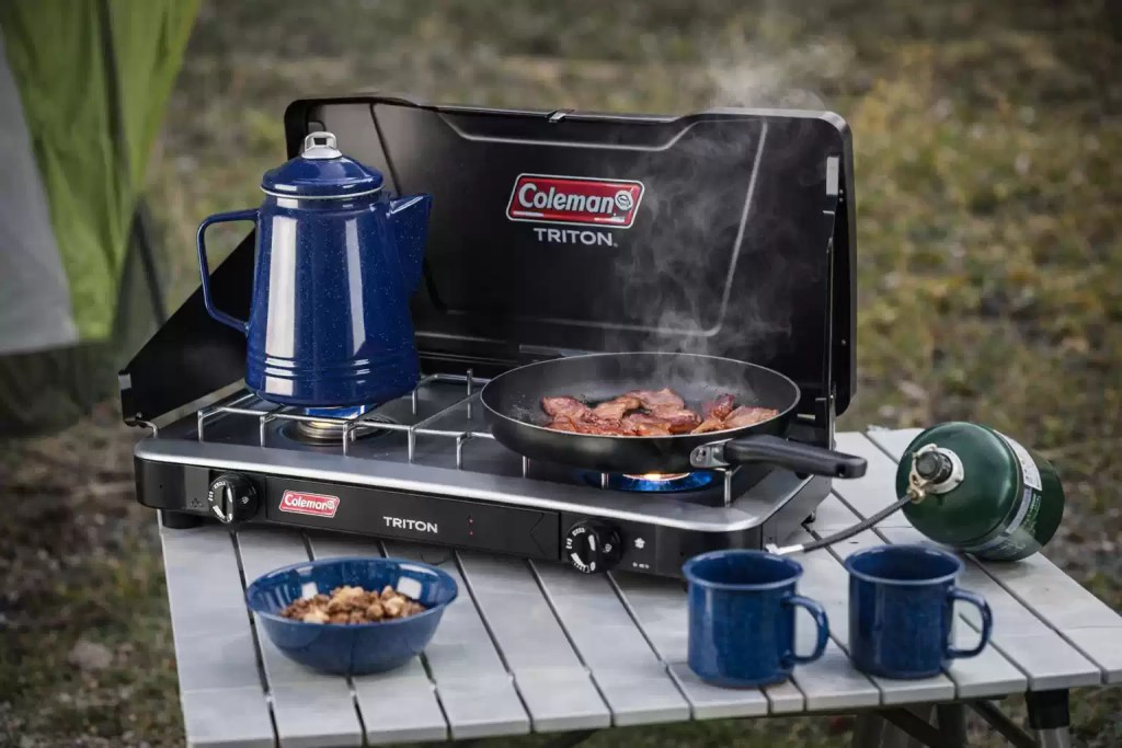 Coleman Triton camping gas stove cooking breakfast outdoors
