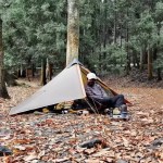 Side view of the professional silnylon tent standing strong in a windy nature hike.