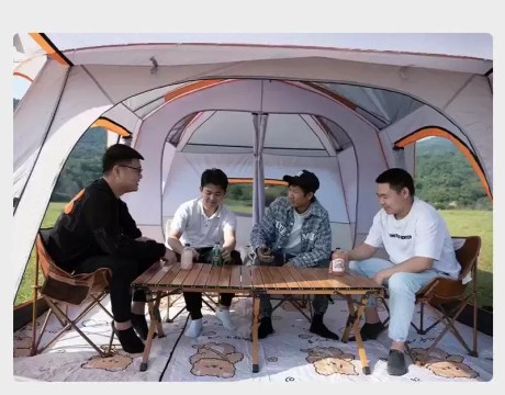 Large family camping tent living room area with table and seating for group camping